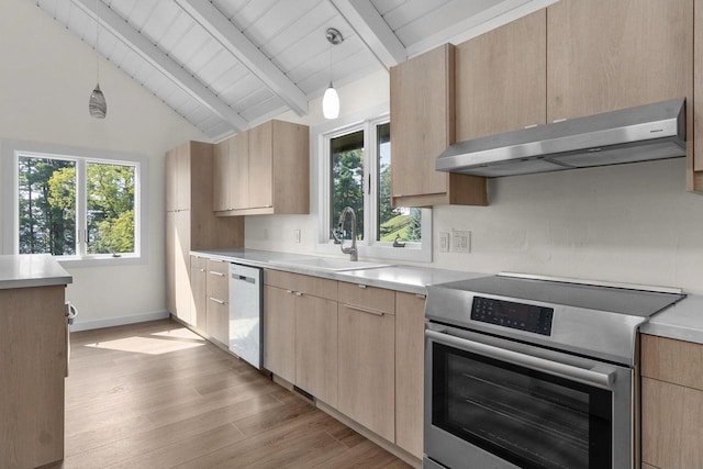 kitchen with under cabinet range hood, stainless steel electric range oven, and light brown cabinetry