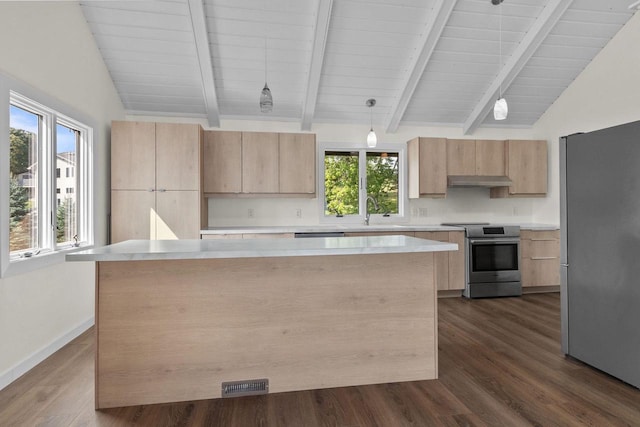 kitchen with a kitchen island, light brown cabinetry, lofted ceiling with beams, light countertops, and appliances with stainless steel finishes