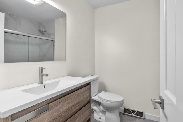 bathroom with visible vents, a shower stall, baseboards, toilet, and vanity