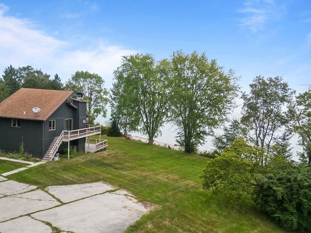 view of yard featuring stairway and a wooden deck