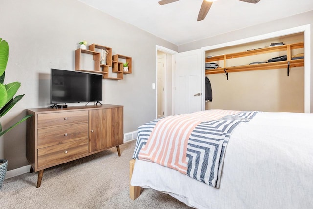 bedroom with visible vents, a ceiling fan, baseboards, and light carpet