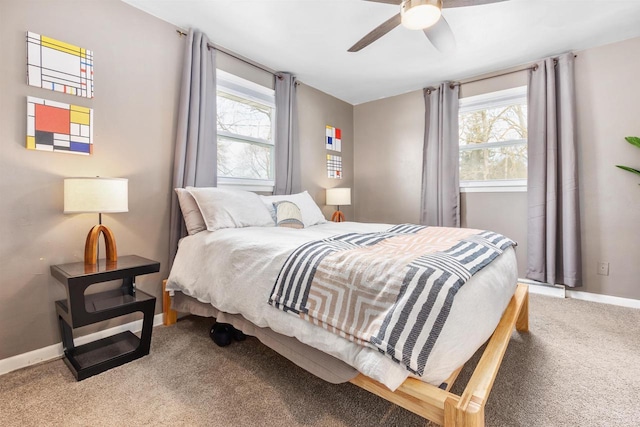 bedroom featuring baseboards, multiple windows, ceiling fan, and carpet flooring