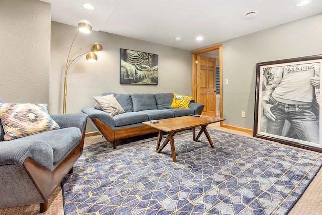 living room with recessed lighting and baseboards