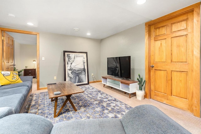 living area with recessed lighting, baseboards, and carpet floors