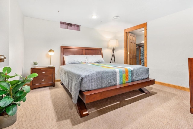 bedroom featuring baseboards and carpet flooring