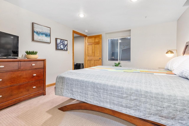 bedroom with recessed lighting, baseboards, and light colored carpet