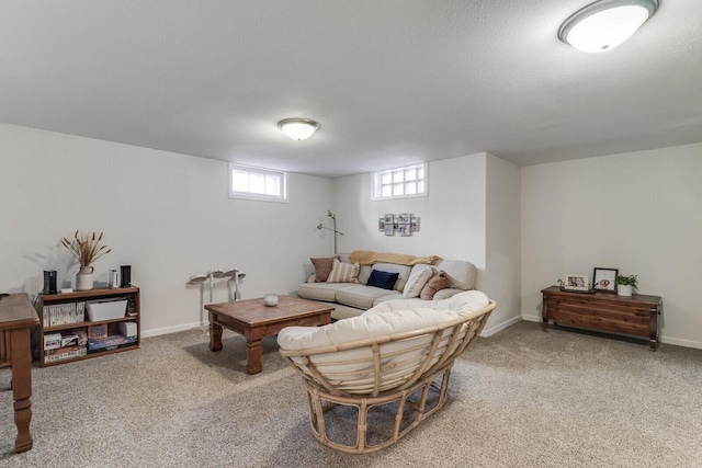 carpeted living area featuring baseboards