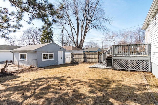 view of yard with a deck and a fenced backyard