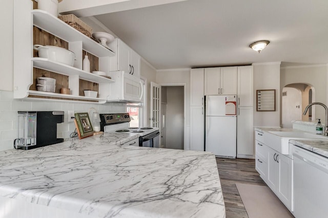 kitchen featuring a sink, white appliances, white cabinetry, and open shelves