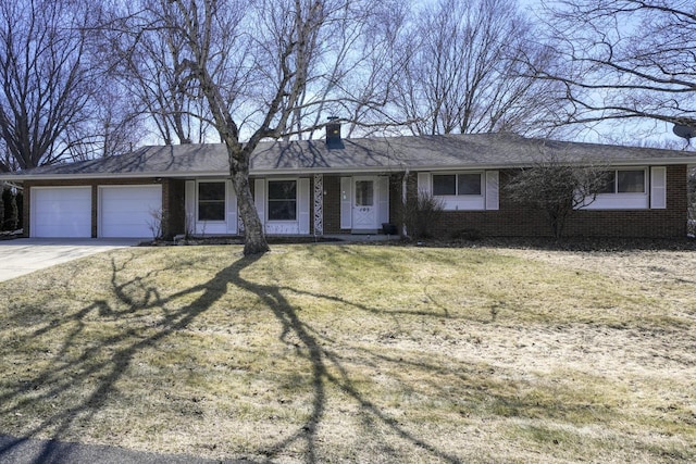 ranch-style house with driveway, a front lawn, an attached garage, brick siding, and a chimney