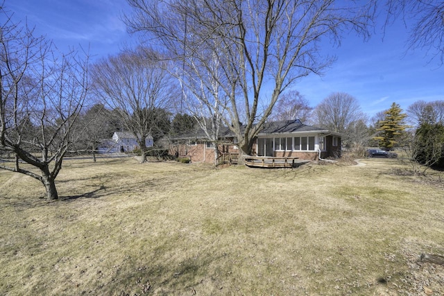 view of yard with a sunroom