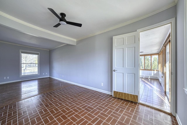 spare room with baseboards, a wealth of natural light, and ceiling fan