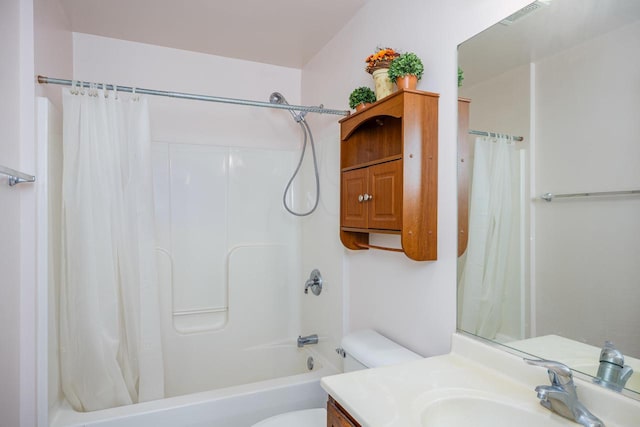 bathroom with vanity, toilet, shower / bath combo, and visible vents