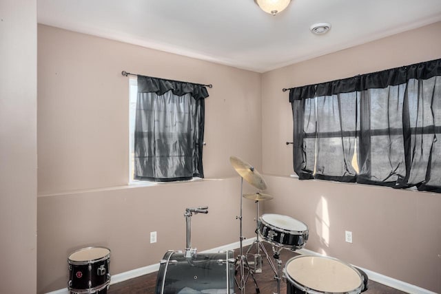 recreation room featuring visible vents and baseboards