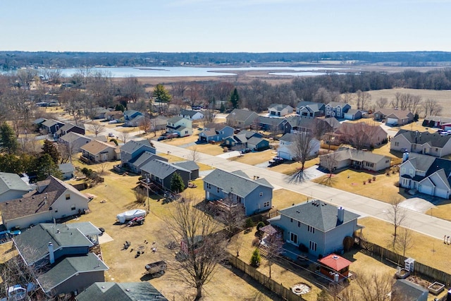 birds eye view of property with a residential view and a water view