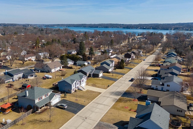 bird's eye view featuring a residential view and a water view