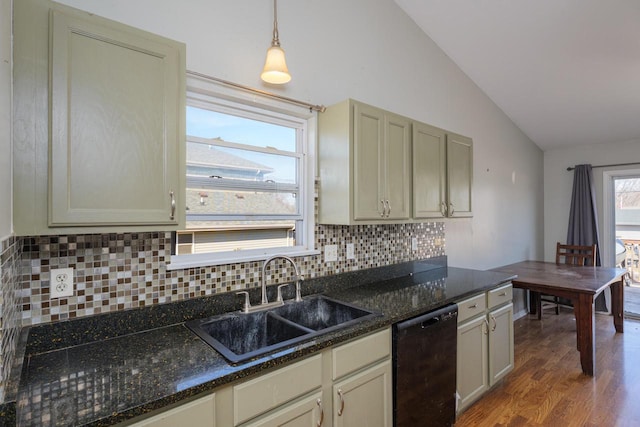 kitchen featuring tasteful backsplash, lofted ceiling, black dishwasher, wood finished floors, and a sink