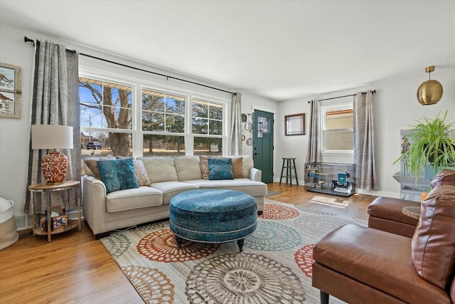 living room featuring baseboards and wood finished floors