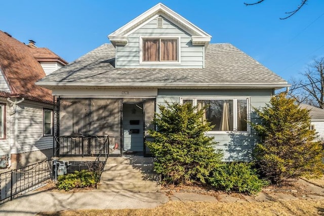 view of front of house featuring a shingled roof