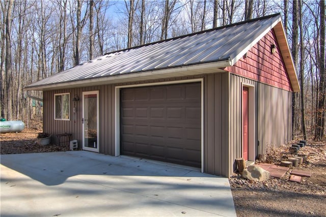 detached garage featuring driveway