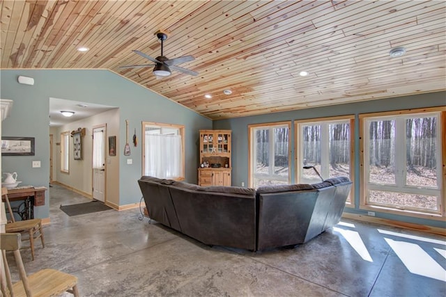 living room featuring lofted ceiling, a ceiling fan, concrete floors, baseboards, and wood ceiling