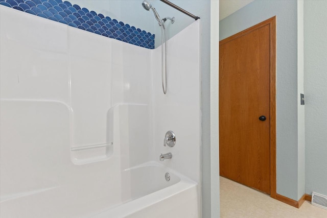 bathroom featuring tile patterned floors, visible vents, and  shower combination