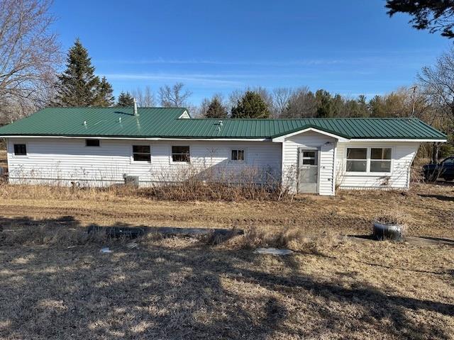 rear view of house with metal roof