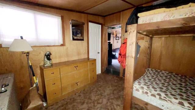 bedroom with wood walls