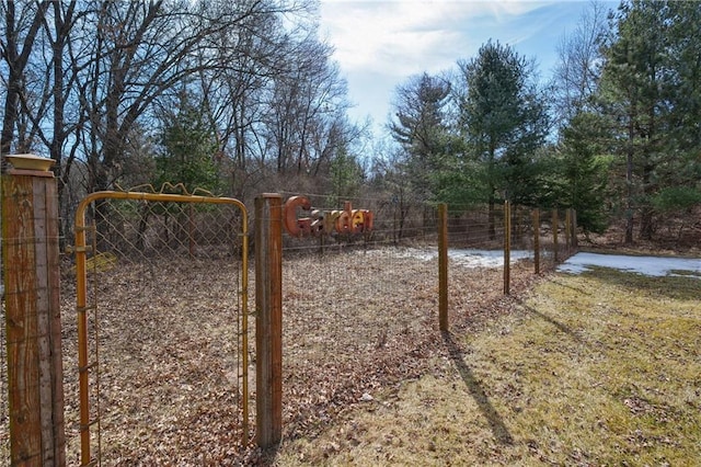 exterior space featuring fence and a gate