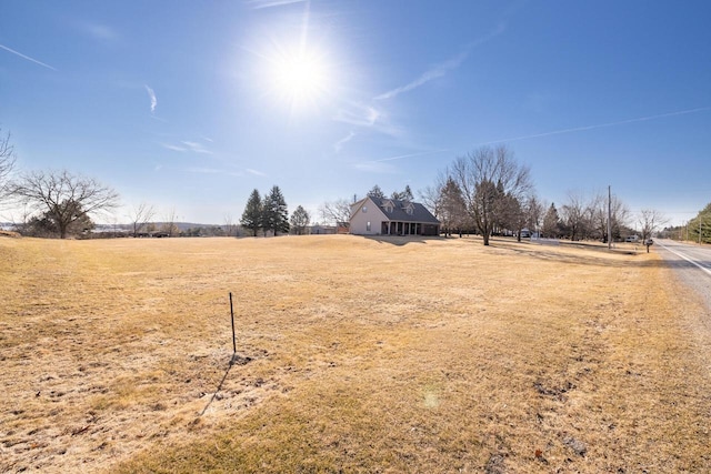 view of yard with a rural view