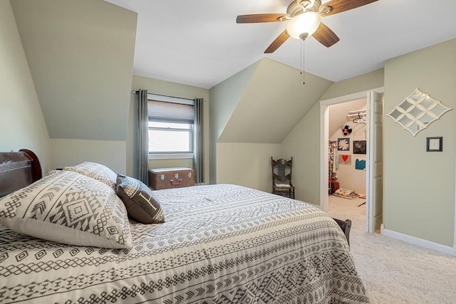 carpeted bedroom featuring baseboards, a ceiling fan, and vaulted ceiling