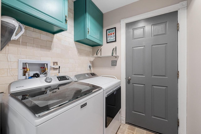 laundry area featuring cabinet space and washing machine and dryer