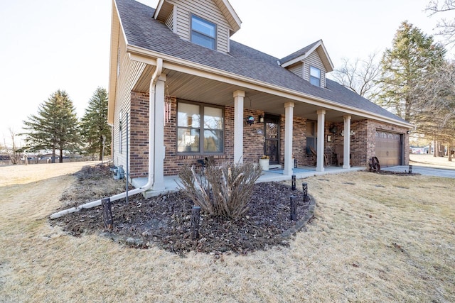 view of front of house featuring a porch, brick siding, a garage, and a shingled roof