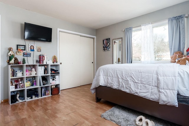 bedroom featuring a closet and wood finished floors