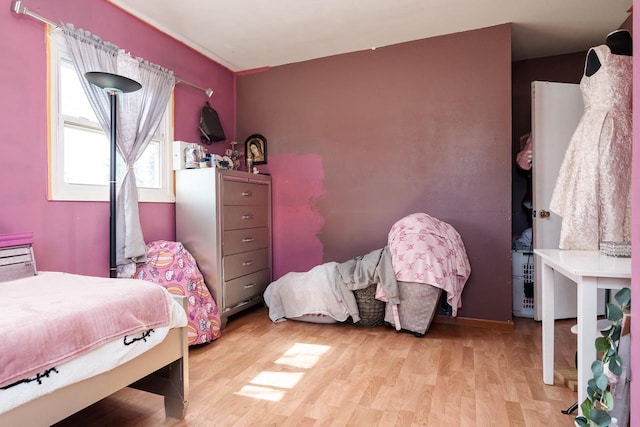 bedroom with light wood-style flooring