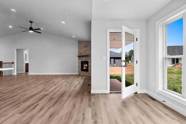 1362 Highland Ridge Dr, De Pere, WI 54115 - unfurnished living room with light wood-style floors, a fireplace, a ceiling fan, recessed lighting, and vaulted ceiling