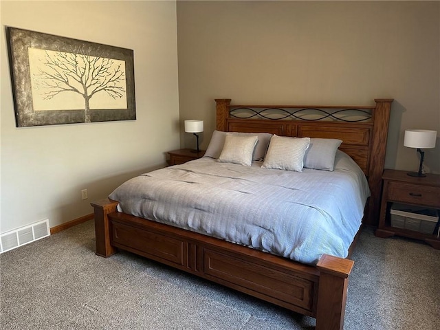 bedroom with visible vents, light colored carpet, and baseboards