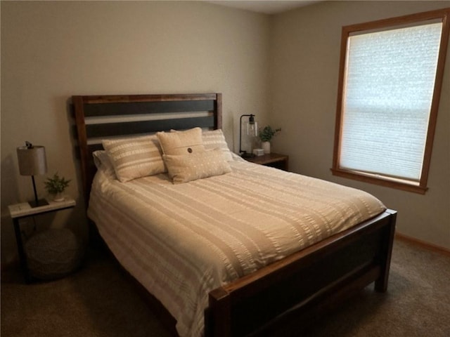 bedroom with carpet and baseboards