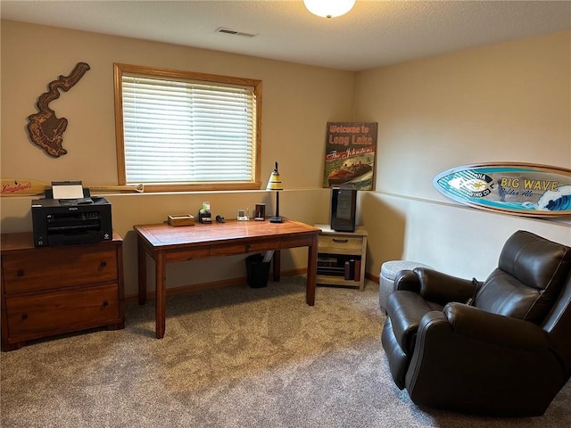 office with visible vents, carpet flooring, and baseboards