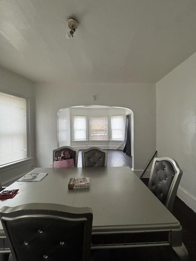 dining space featuring baseboards