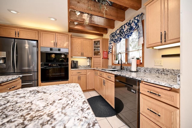 kitchen featuring double oven, black dishwasher, beam ceiling, stainless steel refrigerator with ice dispenser, and a sink