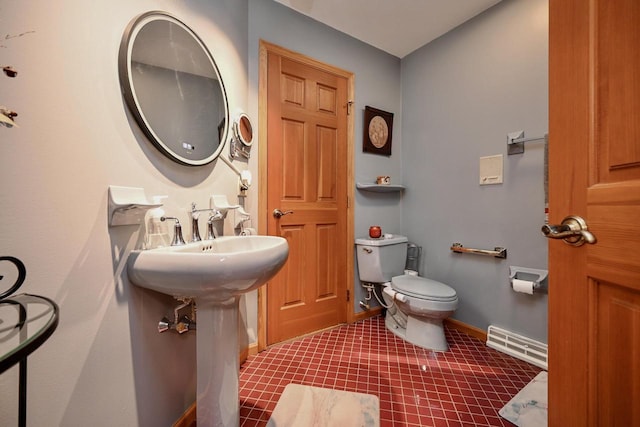 bathroom featuring visible vents, baseboards, and toilet