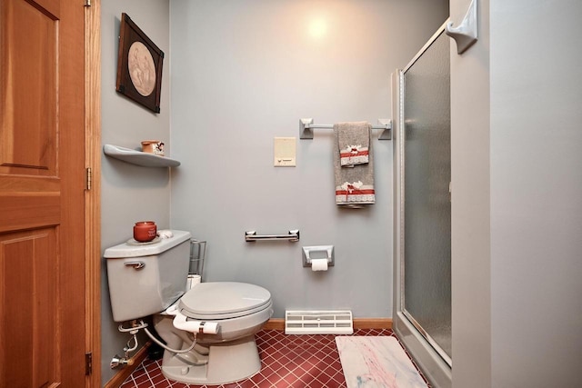 full bath featuring visible vents, baseboards, a stall shower, tile patterned floors, and toilet