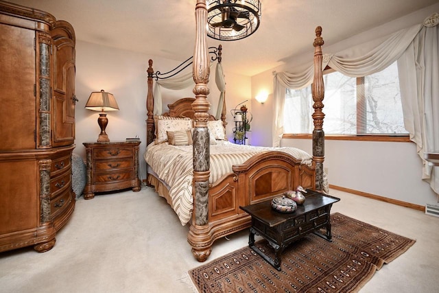 bedroom featuring visible vents, baseboards, and light colored carpet