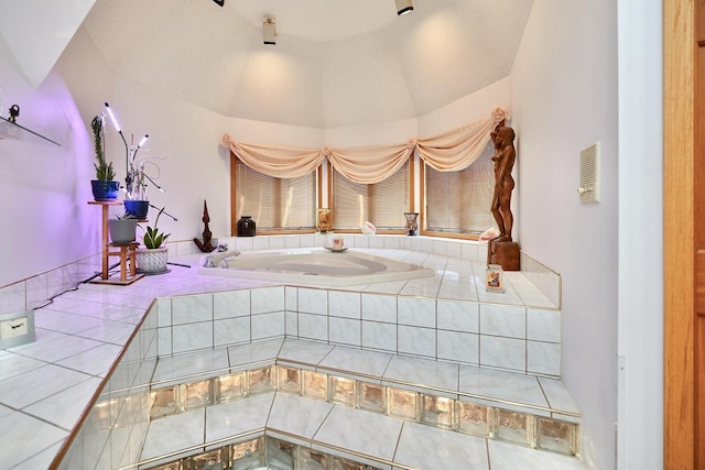 bathroom featuring tile patterned floors and lofted ceiling