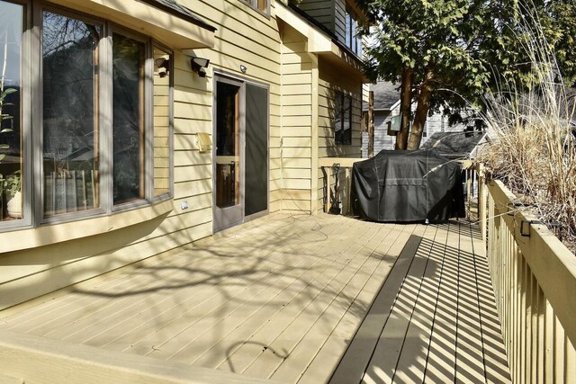 wooden terrace featuring area for grilling