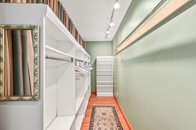 spacious closet featuring light wood-style floors