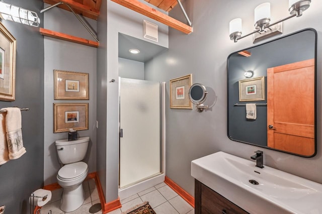 bathroom with vanity, baseboards, a stall shower, tile patterned flooring, and toilet