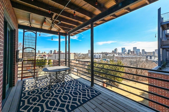 wooden terrace featuring a view of city