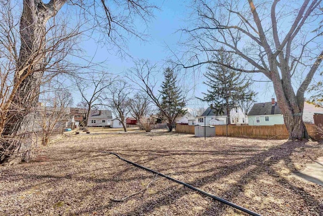 view of yard with fence and a residential view